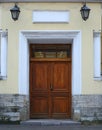 Big old closed light wooden door