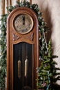 Big old dusty clock shows a few minutes to 12 o\'clock. New Year\'s atmosphere. Selective focus Royalty Free Stock Photo