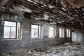 Large old ruined room with garbage and empty windows Royalty Free Stock Photo