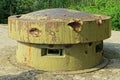 Big old military green rusty iron tower with embrasures Royalty Free Stock Photo