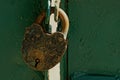 Big old padlock on the iron door Royalty Free Stock Photo