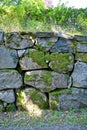 big old wall made of stones covered in moss Royalty Free Stock Photo
