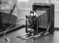 Large format vintage view camera with lens and bellow exposed