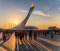 Big Olympic Torch erection with burning flame in Olympic Park was main venue of Sochi Winter Olympics in 2014. People shadows