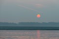 Big Orange Sun rising over the Ganges river, Varanasi, India Royalty Free Stock Photo