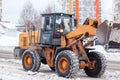 Cleaning and cleaning of roads in the city from snow in winter Royalty Free Stock Photo