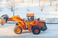 Cleaning and cleaning of roads in the city from snow in winter Royalty Free Stock Photo