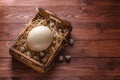 Big ostrich egg on straw surround by quail eggs, copyspace Royalty Free Stock Photo
