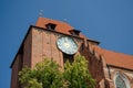 Big outside ancient clock on the Old Town Hall in Torun, Poland. Royalty Free Stock Photo