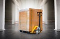 Big Package Boxes Wrapped Plastic on Pallets and Hand Pallet Truck. Shipment Boxes, Supplies Warehouse Shipping. Royalty Free Stock Photo