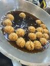 Meatballs frying in the hot oil