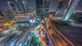 Dubai International Financial district aerial night timelapse. Panoramic view of business and financial office towers. Royalty Free Stock Photo