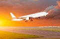 Big passenger airplane take off at sunset clouds on a runway. Royalty Free Stock Photo