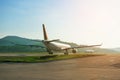 Big passenger airplanes on runway strip are taxiing for take-off