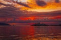 Big passenger ferry ship on sunset background in Vlore city port. Wonderful sunset on Adriatic Sea in western Albania, Europe.