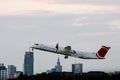 The big passenger plane takes off at the city airport. Royalty Free Stock Photo