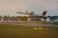 The big passenger plane takes off at the city airport. Royalty Free Stock Photo