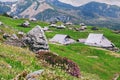 Big Pasture Plateau in the Kamnik Alps, Slovenia. Mountain cottage hut or house on green hill. Alpine meadow landscape. Farm Royalty Free Stock Photo