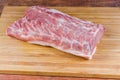 Piece of the uncooked pork loin on the cutting board Royalty Free Stock Photo