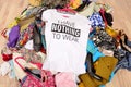 Big pile of clothes thrown on the ground with a t-shirt saying n