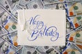 Big pile of money. stack american dollars backgrounds with text Happy Birthday. Calligraphy lettering Royalty Free Stock Photo