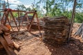 Big pile of reinforced steel bar, rebar, and stacked wood was left messily at a work site on a sunny day Royalty Free Stock Photo