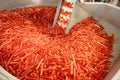 Big pile of small blanks to create plastic beer bottles