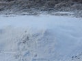 A big pile of snow near the road