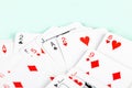 A big pile of tiny small scattered playing cards, macro, closeup, deck. Heap of mini cards face up abstract blue background Royalty Free Stock Photo