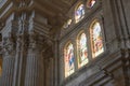 Big pillars and stained glass windows in Malaga Cathedral, Spain