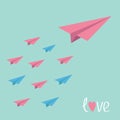 Big pink paper plane with small planes. Love card.