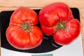 Big pink tomatoes on the digital kitchen scale, top view Royalty Free Stock Photo