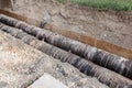 Big pipes in hole in the ground covered with dirt