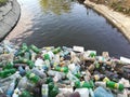 Water pollution, plastic bottles and garbage on river surface Royalty Free Stock Photo