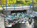 Water pollution, plastic bottles and garbage on river surface Royalty Free Stock Photo