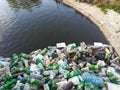 Water pollution, plastic bottles and garbage on river surface Royalty Free Stock Photo