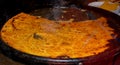 Big Plate of Farinata or Cecina or Torta di ceci thin unleavened pancake or crepe of chickpea flour Royalty Free Stock Photo