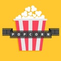 Big Popcorn. Film strip ribbon line with text. Red white box. Cinema movie night icon in flat design style. Yellow background. Royalty Free Stock Photo