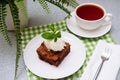 Big portion of brownie with a ball of vanilla ice-cream on top