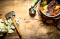 Big pot of soup with beef and fresh vegetables. Royalty Free Stock Photo
