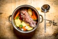 Big pot of soup with beef and fresh vegetables. Royalty Free Stock Photo