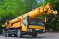 Big Power Mobile Crane on a road and tower crane in construction site Royalty Free Stock Photo