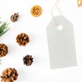 Big price tag with fir branch, cones, orange, Christmas balls Royalty Free Stock Photo