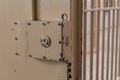 Big lock on prison door with bars Royalty Free Stock Photo