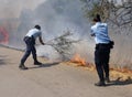 GNR police officers are fighting against the flames
