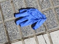 Plastic gloves everywhere in public ways during corana crisis Royalty Free Stock Photo