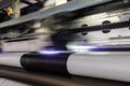 Big professional printer, processing massive vinyl rolls. Royalty Free Stock Photo