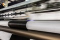 Big professional printer, processing massive vinyl rolls. Royalty Free Stock Photo