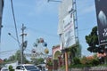 Big promotional billboards plastered on the roadside.