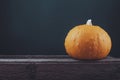 Big pumpkin on a wooden background. space for text. Halloween, rustic